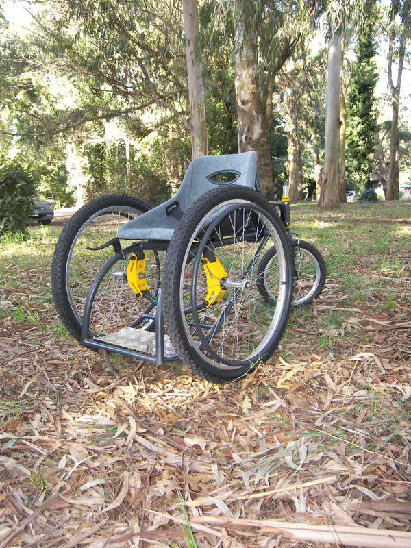 This product is designed to meet the travel needs of a person with reduced motor skills in the lower limbs. The disabled is today with many barriers in society being limited in sport the high cost of special wheelchairs. What is sought is to make a product that can compete with wheelchairs that are in the market today in terms of costs and benefits. It combines the qualities of a common wheelchair a chair with the sport giving users certainty about the rigidity of the structure a third point of support provided by the rear wheel and a comfort in the displacement that gives the suspension system and road of 26 ¨ front wheels. It has a suspension system that adapts to the weight of the user and a regulator of camber in the front wheels. The armchair is constructed as a fiberglass monocoque with a upholstery designed to give comfort and a better position to user also has an adjustable belt.