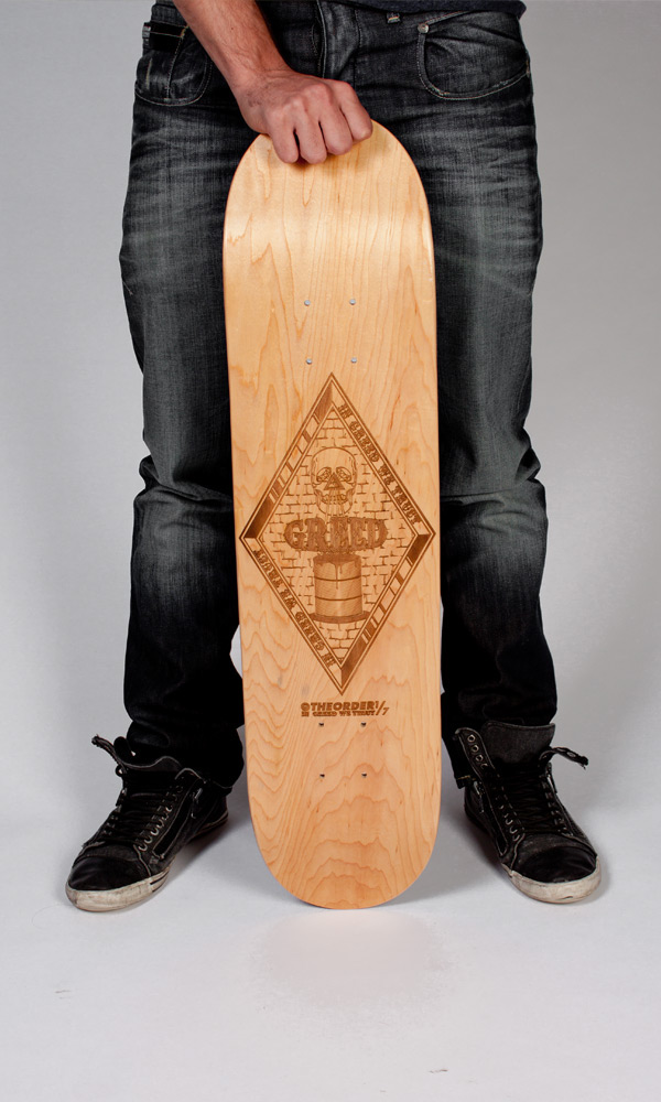 greed Order gold skateboard artboard trust black etch laser Sharp wood burn brand