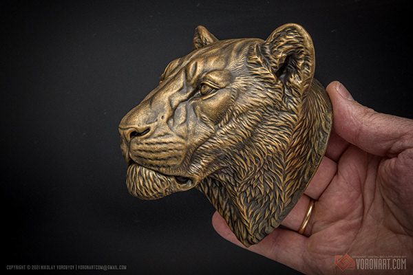 Bronze lioness sculpture. Hand painted