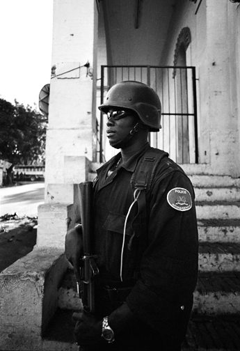 Haiti political oppression Port de Paix Gonaives Jean-Bertrand Aristide Gérard Latortue Boniface Alexandre hurricane jeanne port Au Prince politics civil-war rebels refugee anti-aristide Cite Soleil bel air MINUSTAH Brazilian Marines U.N. national Haitian police Nationale d'Haiti death Poverty child orphan orphanage destitution Cry pain loss b&w Human Condition reportage Military francophone French South America tanks weapons Caribbean