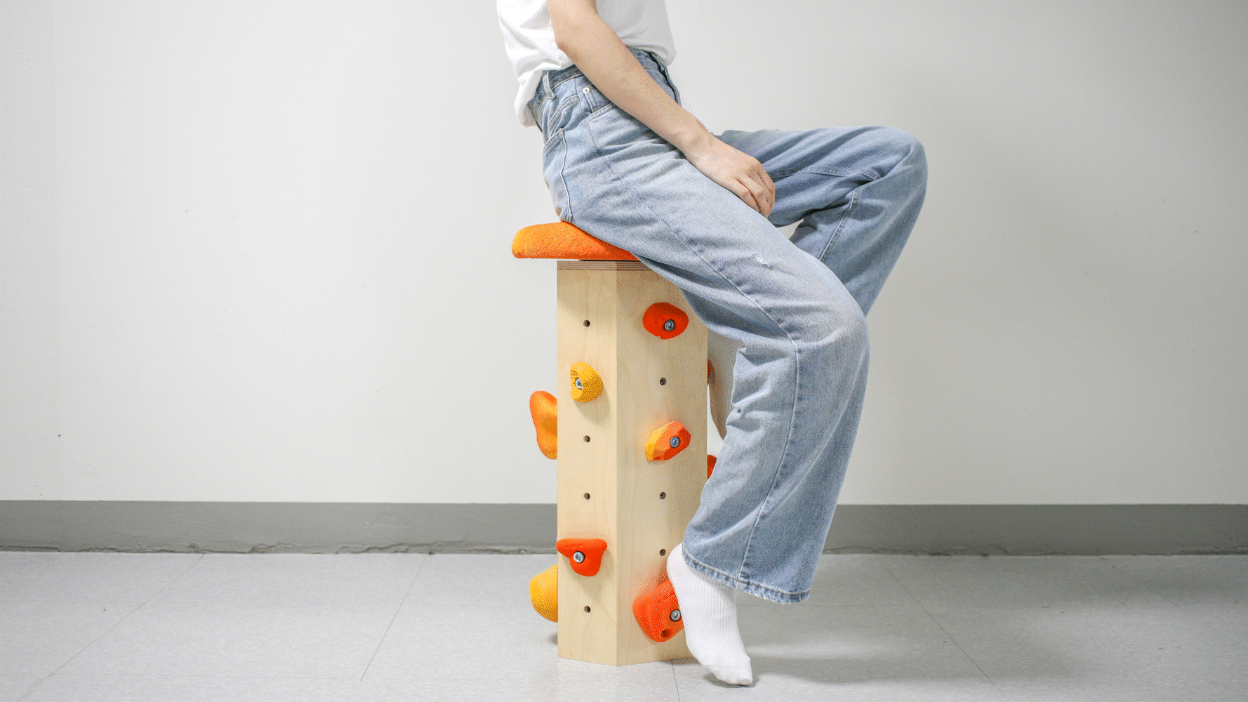 This playful bar stool uses rock climbing hand grips as foot rests