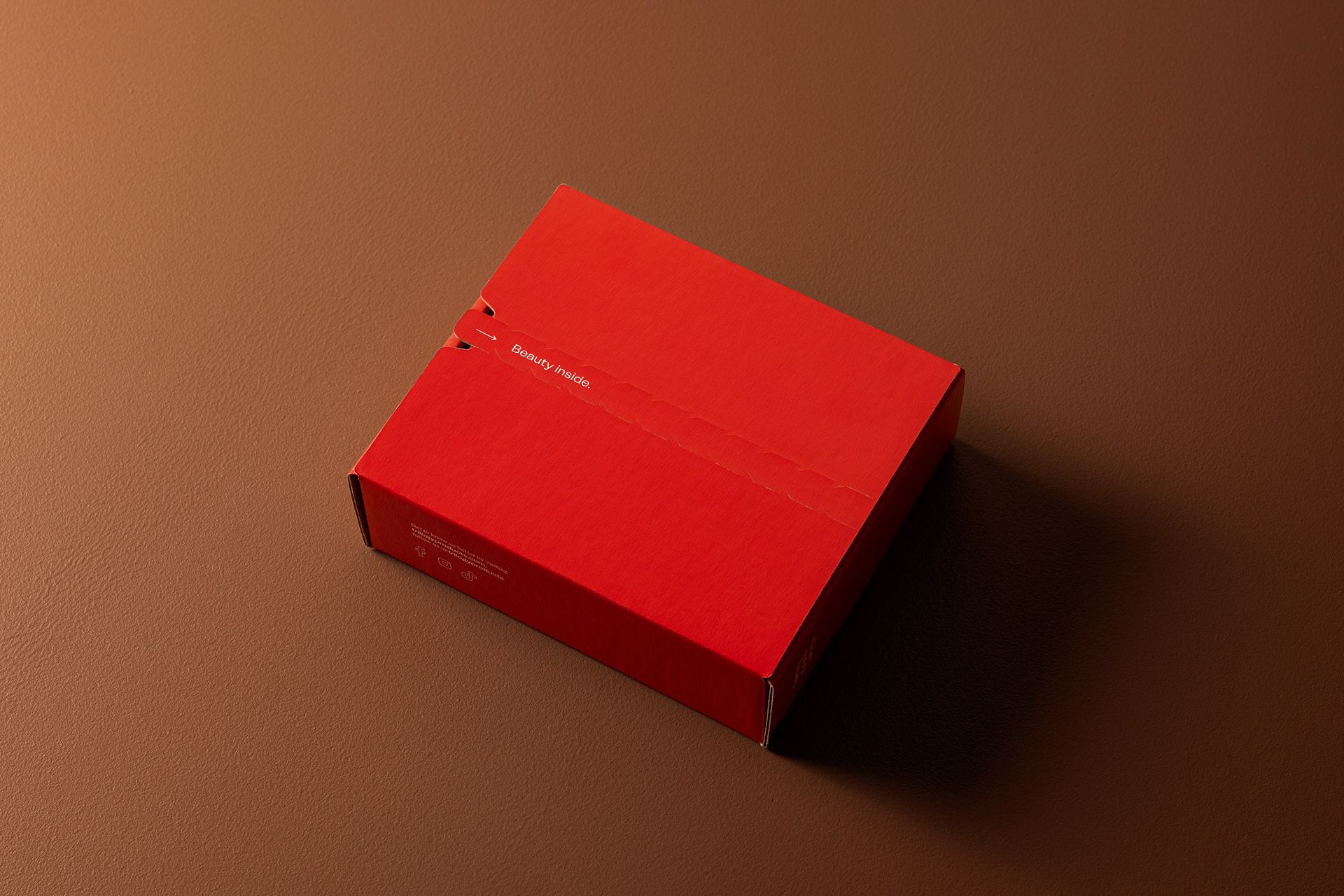 Sealed red box for Trilgoy Beauty Products on a brown backdrop