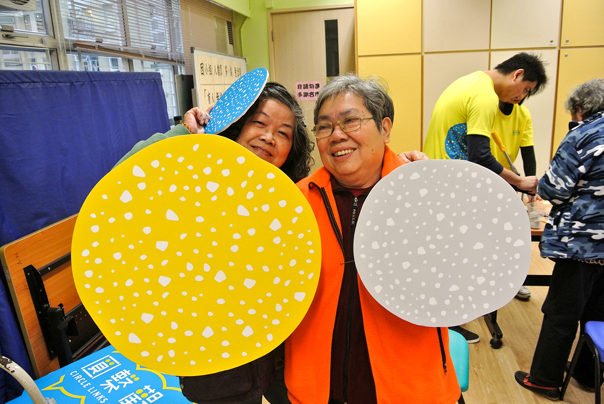 Hong Kong Kwun Tong NGO circle blue yellow identity campaign festival people