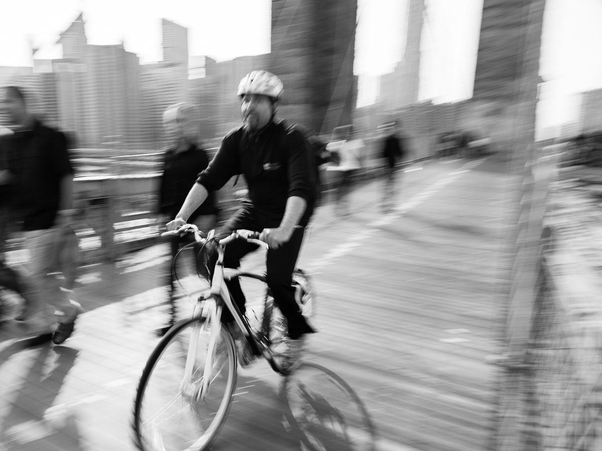 Adobe Portfolio Manhattan Bridge commuters New York Manhattan Slow motion Speeding Bicycle bicycling Brooklyn