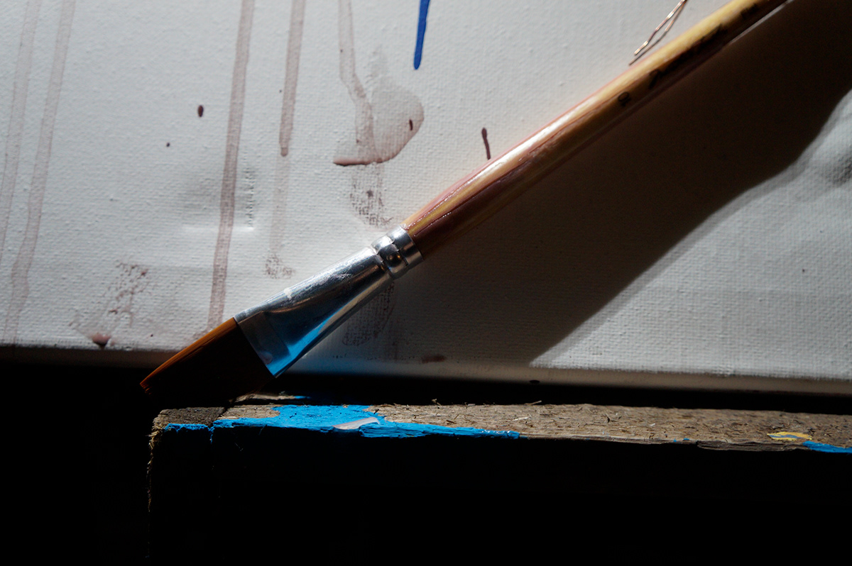 blue canvas paint brush