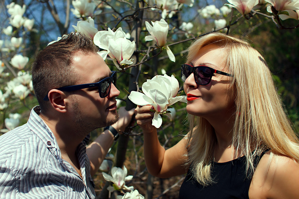 blonde girl magnolia flower man in glasses White