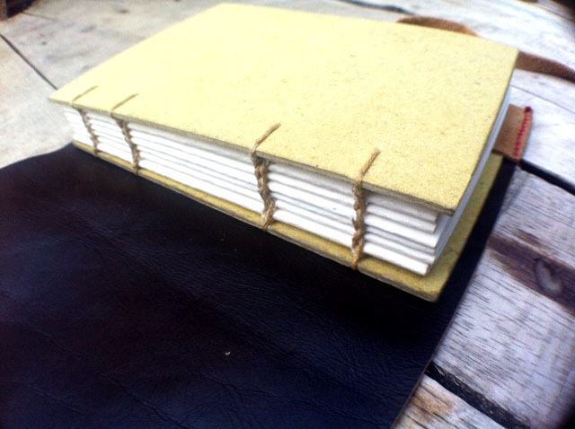 Bookbinding coptic leather book handstitch