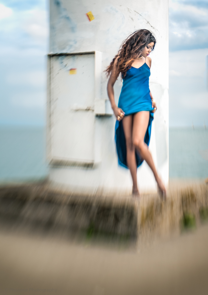 light tower sea lake water wind Outdoor black model blue dress lensbaby