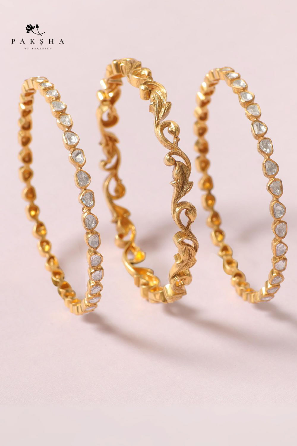 An image of a gold - plated silver bracelet with Moissanite stones by Paksha