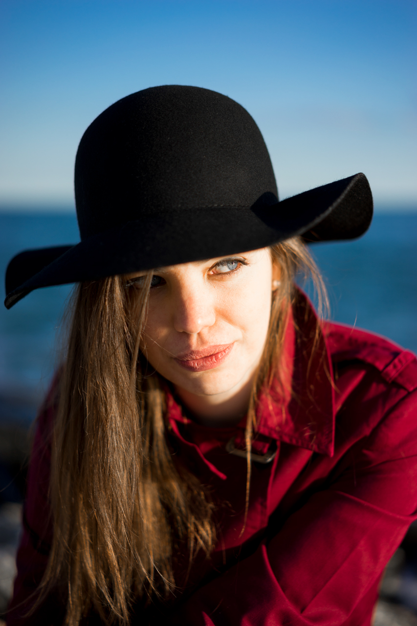 portrait colors Fashion  sea beauty girl red trench black hat wind Sun