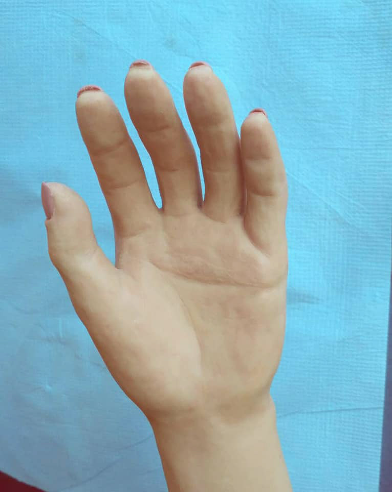 Image may contain: hand, nail and finger
