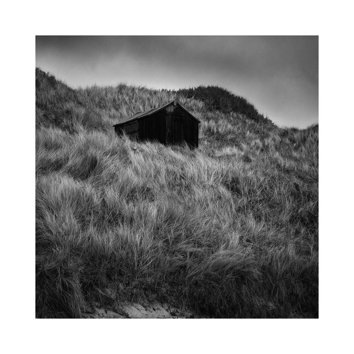 bay beach black and white Castle Coast dark dunes northumberland sea wind