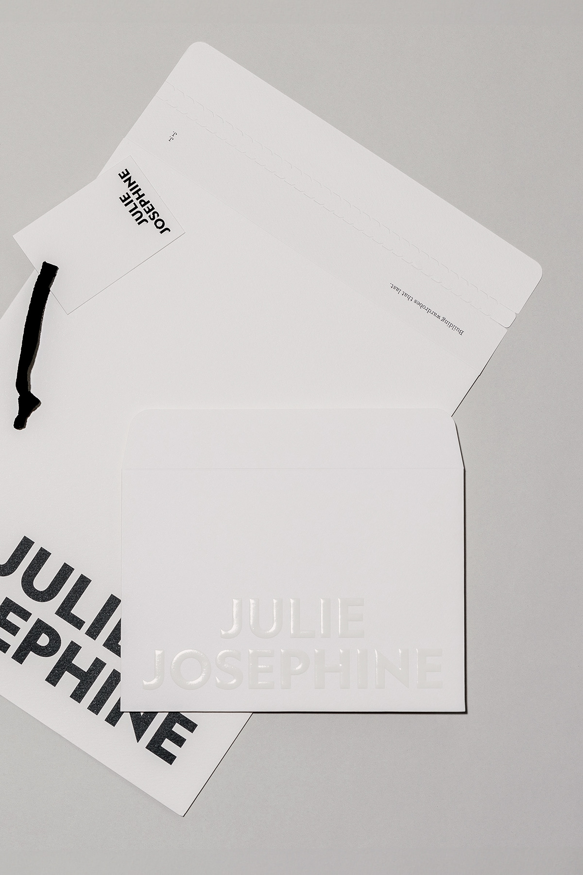 A collection of white stationery and print materials for fashion label Julie Josephine