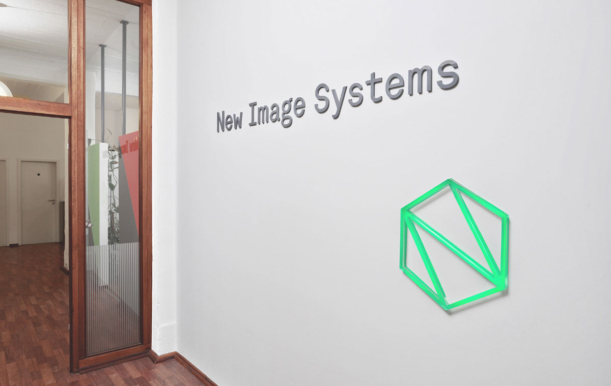 interactive wall sign illuminated logo server system multicolor Internet of Things hexagon IT
