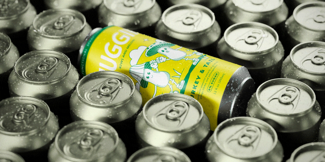 Yellow Huggin tonic cans with water droplets, between gray cans.