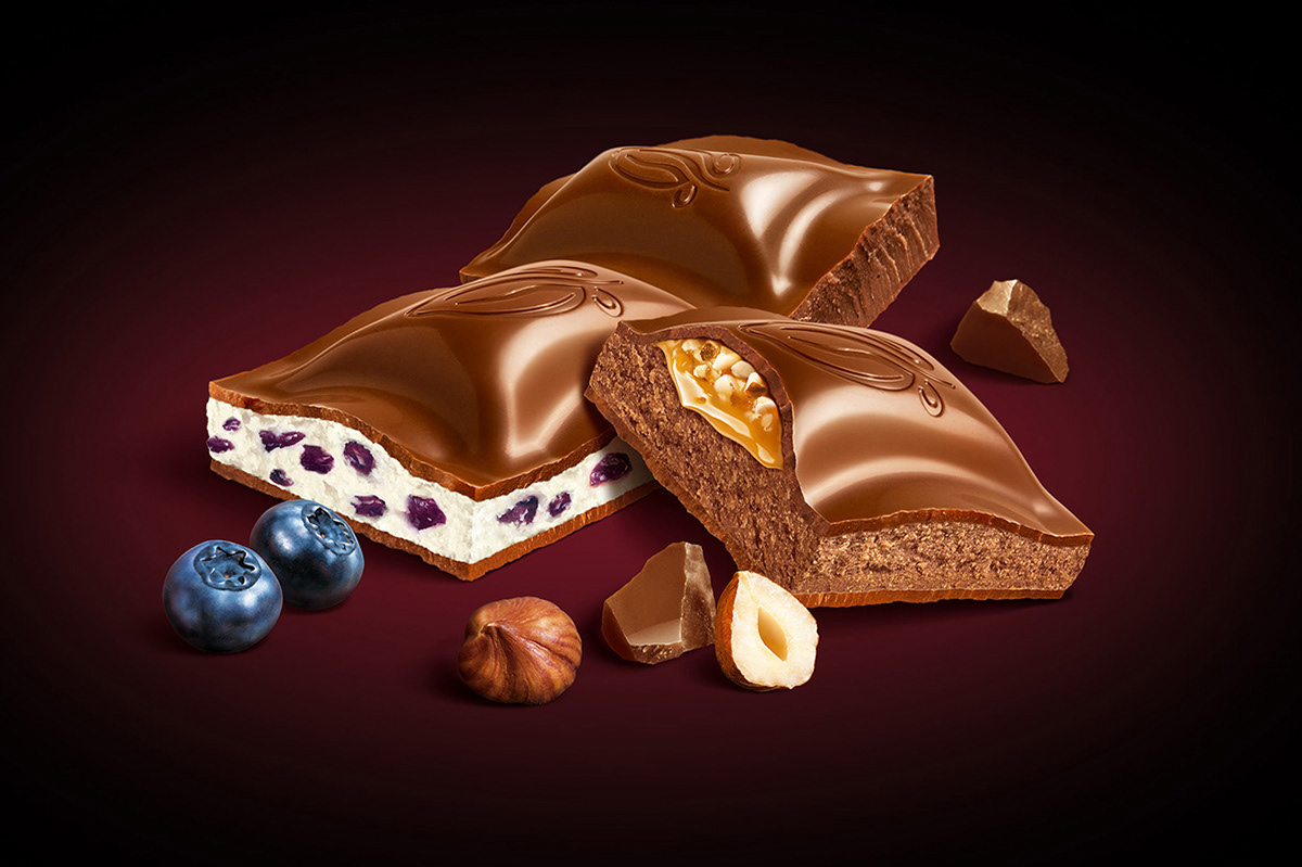 Photo-realistic illustration of Orion chocolate pieces with cream, caramel, fruit and nut fillings. 
