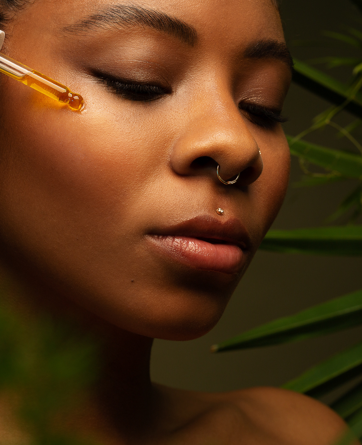 Close up beauty portrait of black skin and face serum by woman photographers Ella Sophie, Oakland