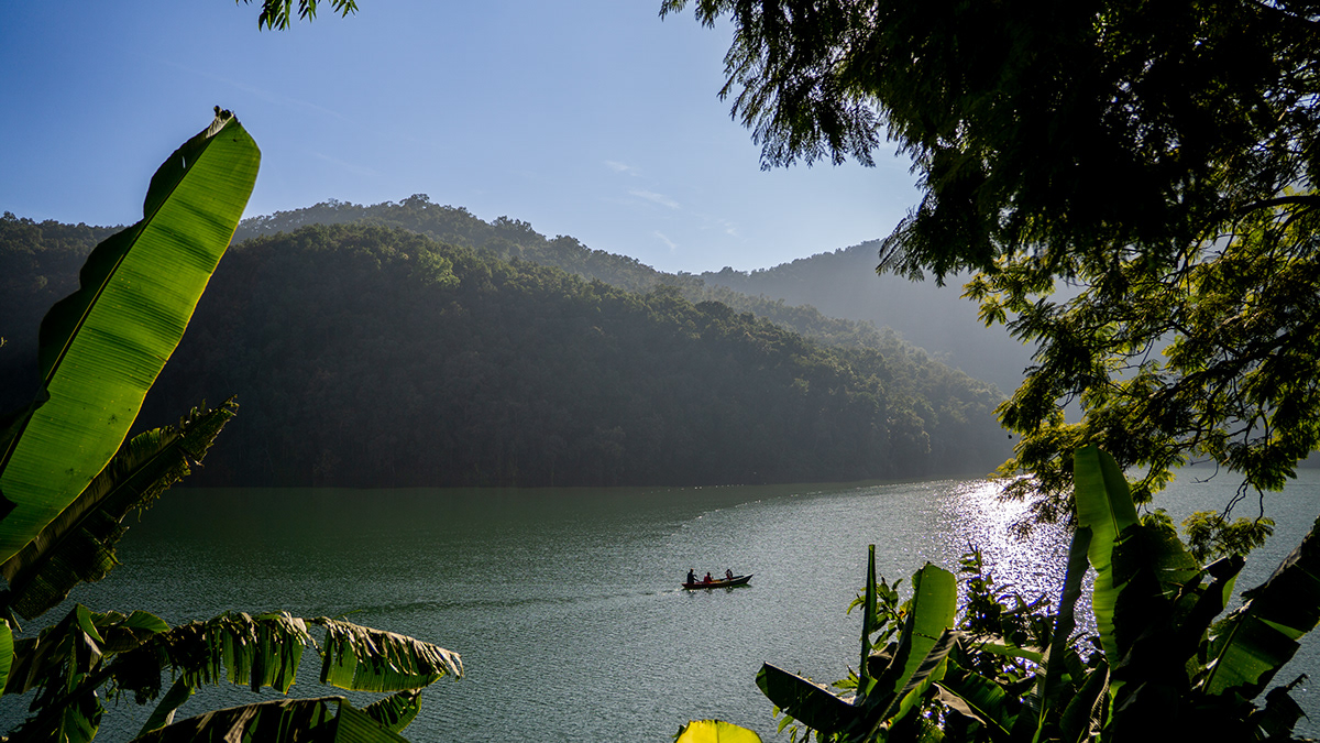 group of people kayaking at the middle of the Phewa lake in Pokhara, Nepal