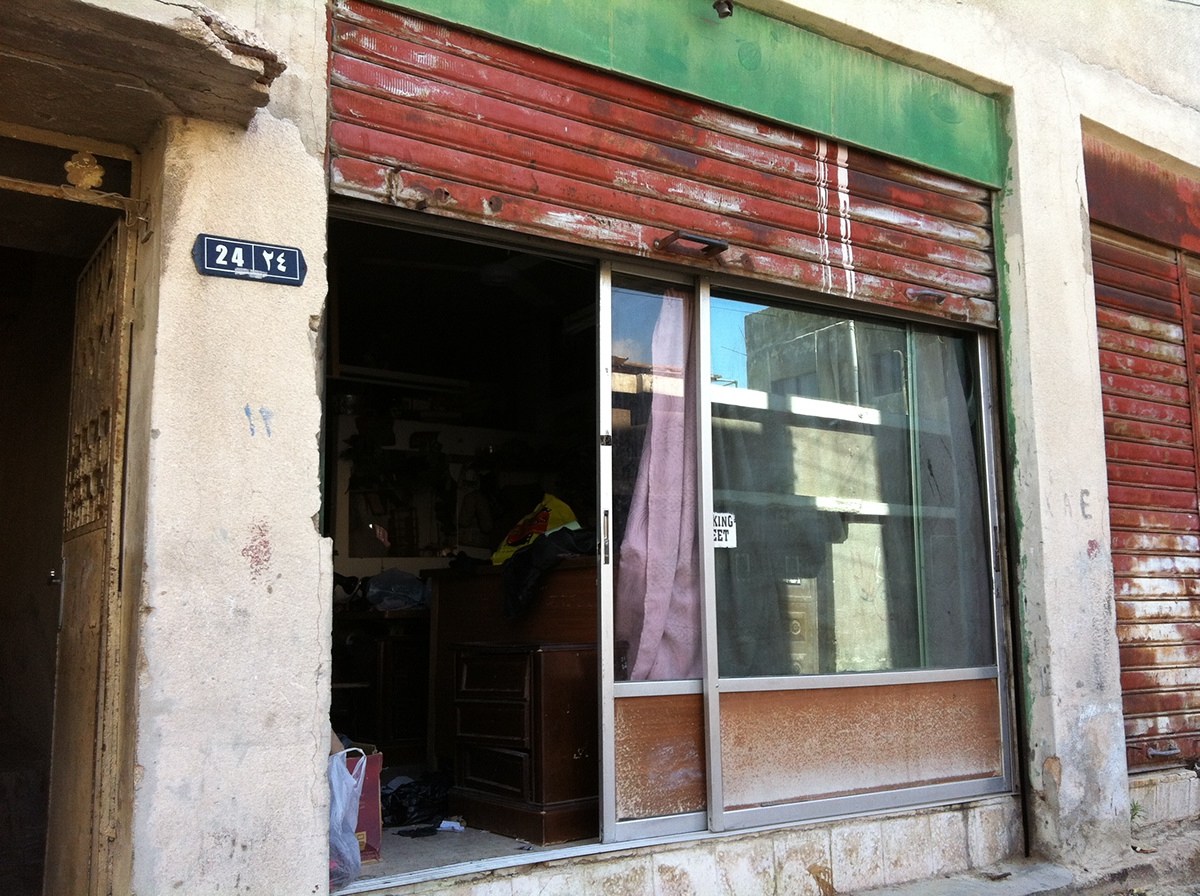 wajha tailor facade Signage vintage amman ali almasri hussein alazaat deaf arabic shop front logo