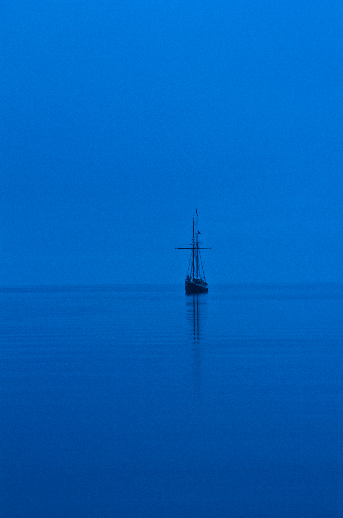Moody blue Sail sailing fog crisp vessel creeping MORNING listen