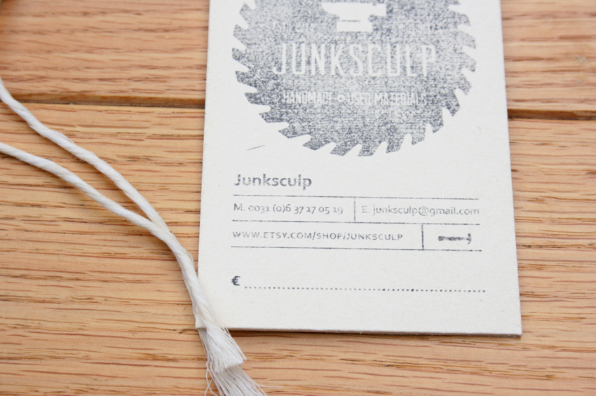 junk sculpture stamp cardboard logo
