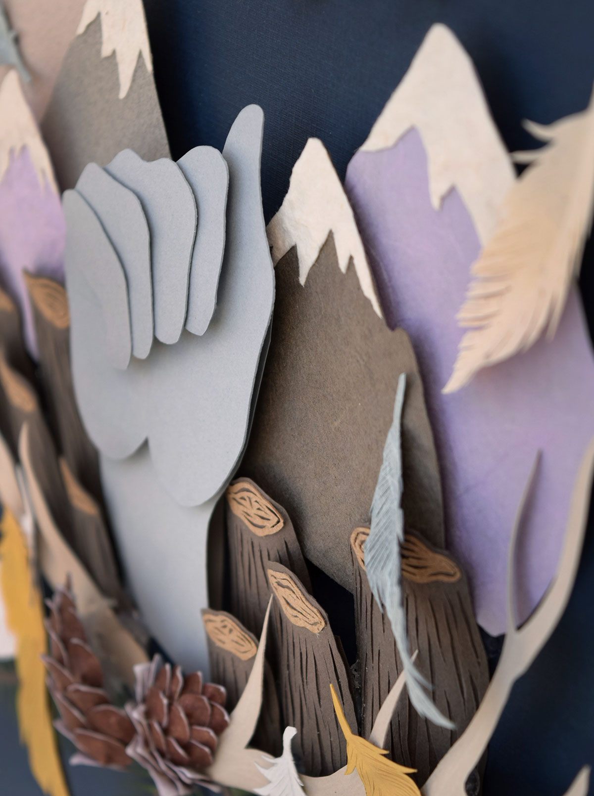 winter paper craft feathers hand Tree  stumps Deforestation blue navy pinecones 3D gold mountains purple