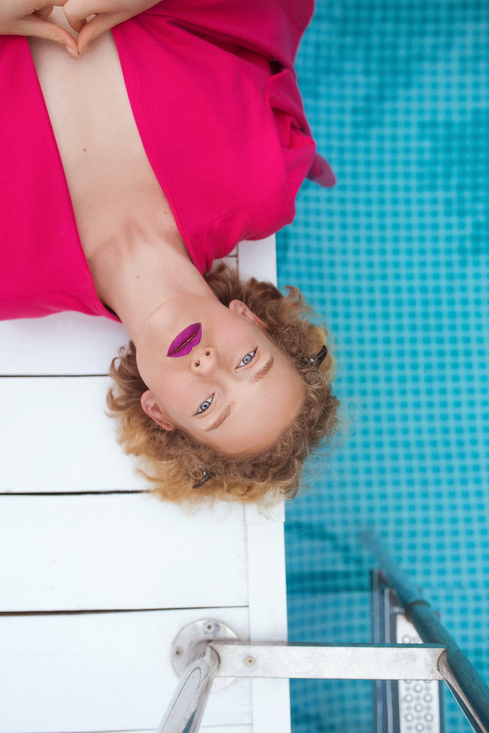 fuchsia Beautiful redhead woman Fashion  photo photographer Sunglasses lipstick swimming pool