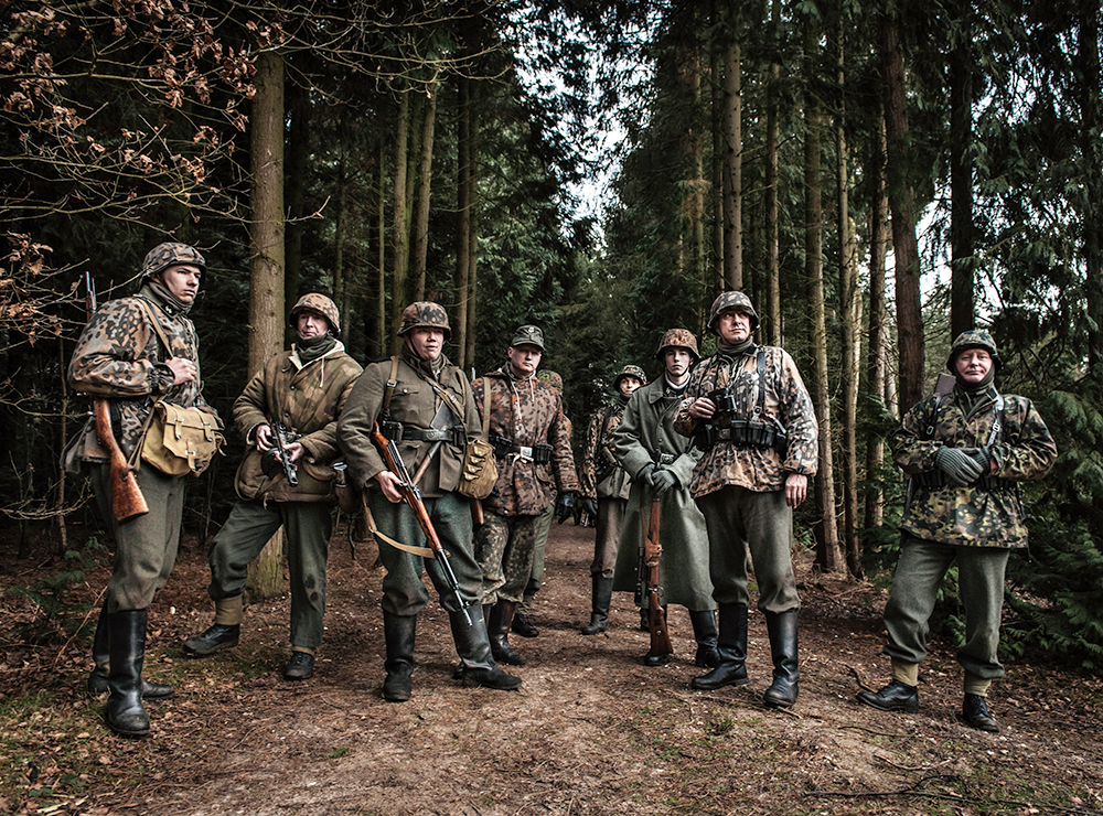 ww2 living history re-enactors battle german soldiers german camourflage uniform War Film Set guns woodland winter
