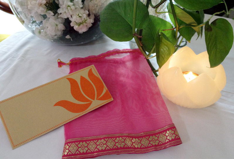wedding card design Lotus gold customised wedding invites designer wedding cards traditional indian motifs screen printing Delhi emboss pink envelopes drawstring bags Dye cut border art indian wedding