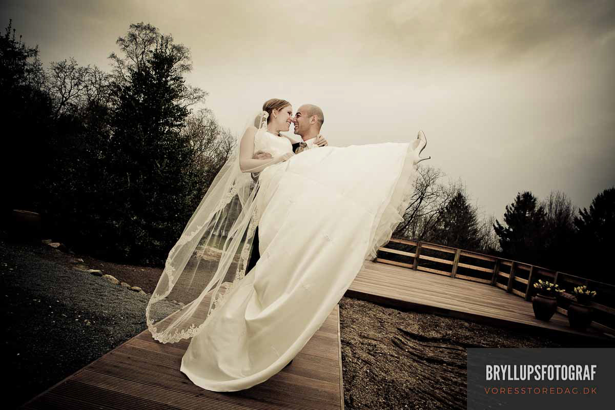 Image may contain: wedding dress, sky and bride