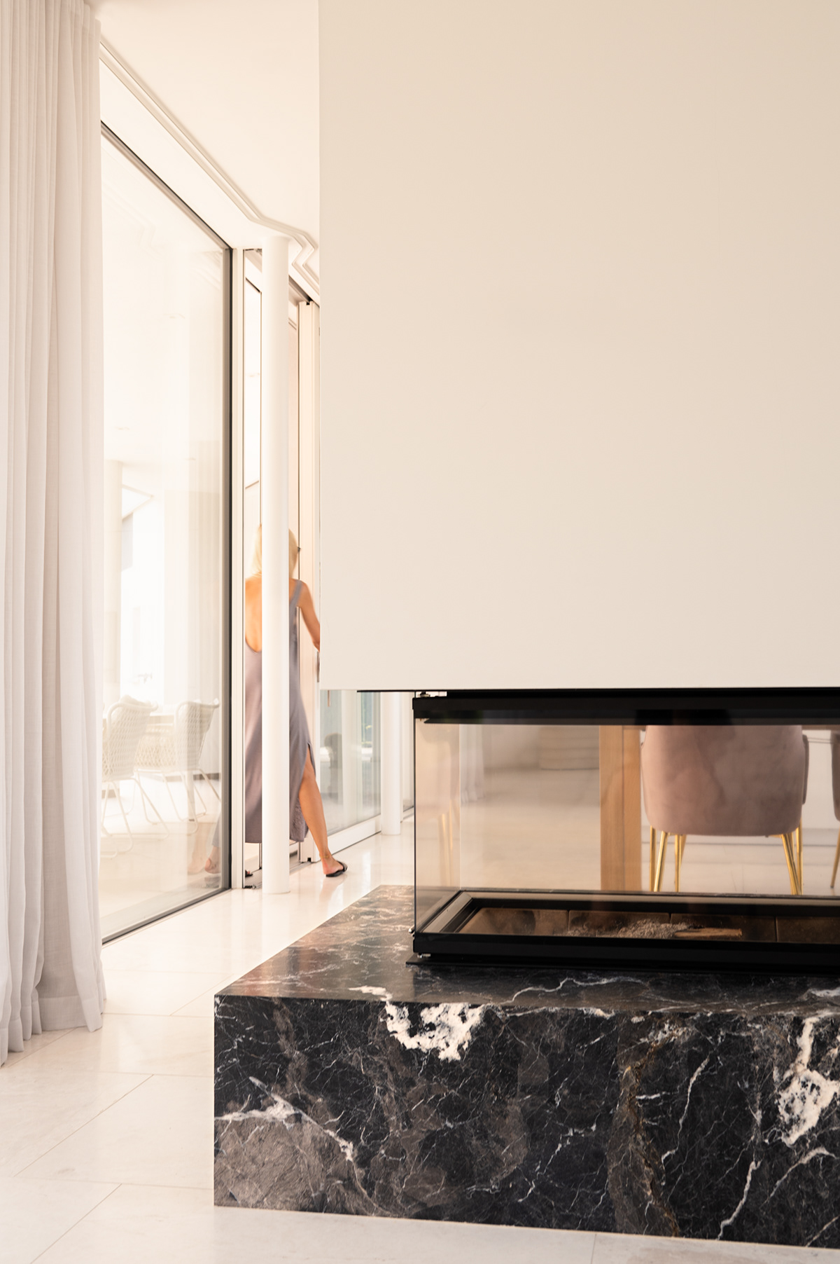 Marble freestanding fireplace in modern minimalistic house