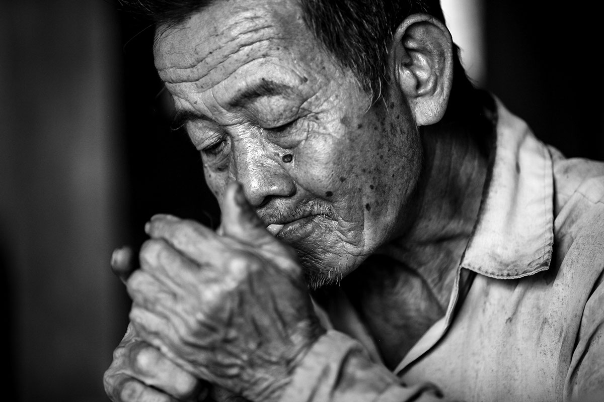 vietnamese man old black and white strong contrast crisp story vietnam smoking portrait Documentary 