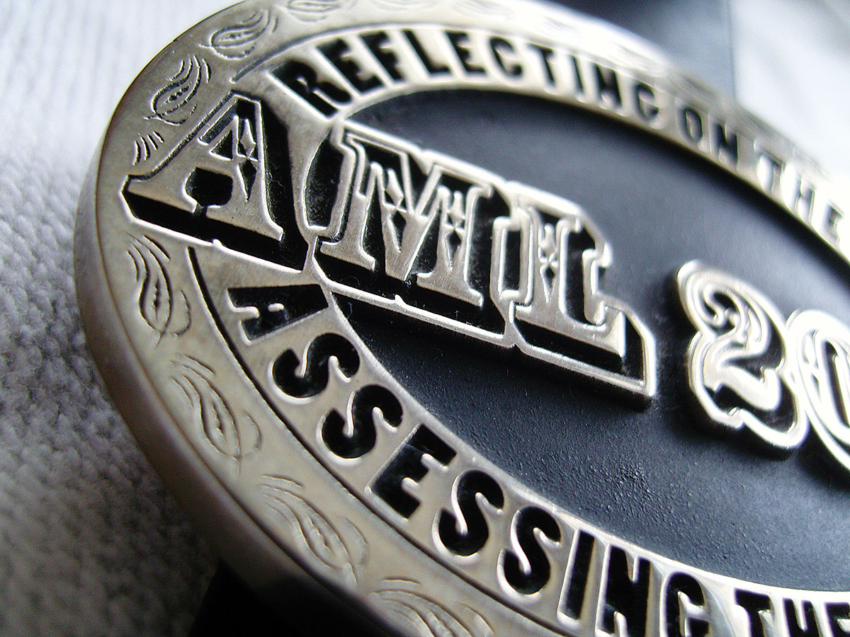 belt buckle conference woodcut type