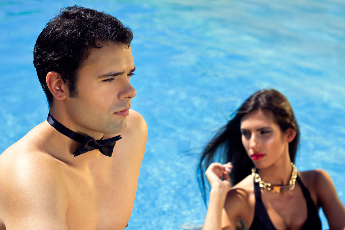 editorial photoshoot girl boy waiter garçon swimming pool sexy sensual trikini float blue summer drink grapes