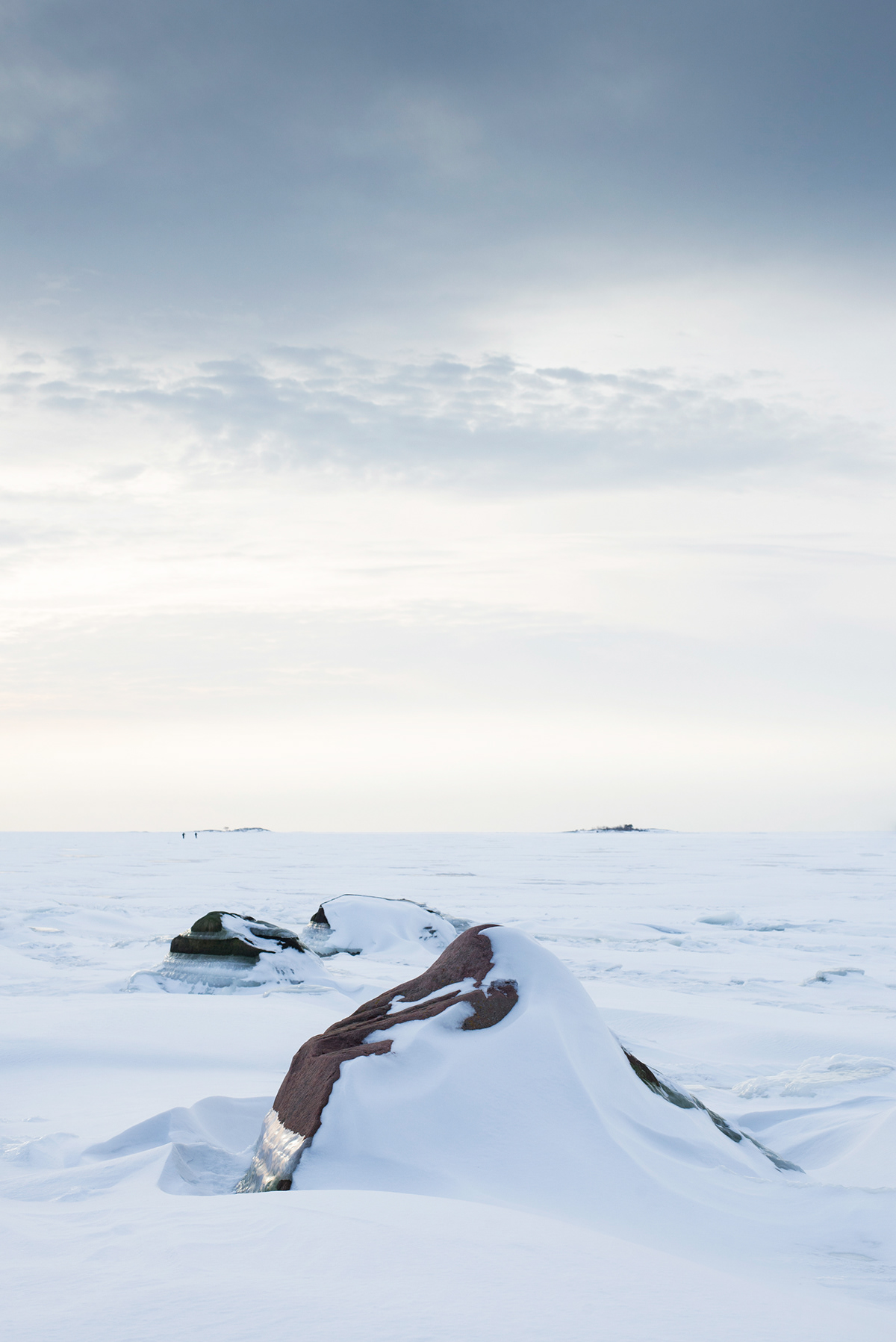 winter snow ice stones rocks baltic sea lauttasaari finland