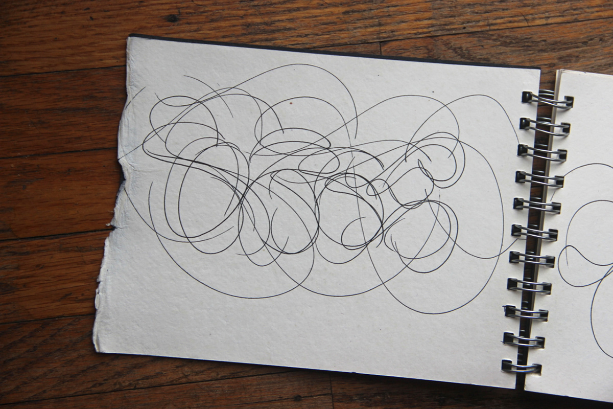 Blackbook sketchbook paper ink motion illegible