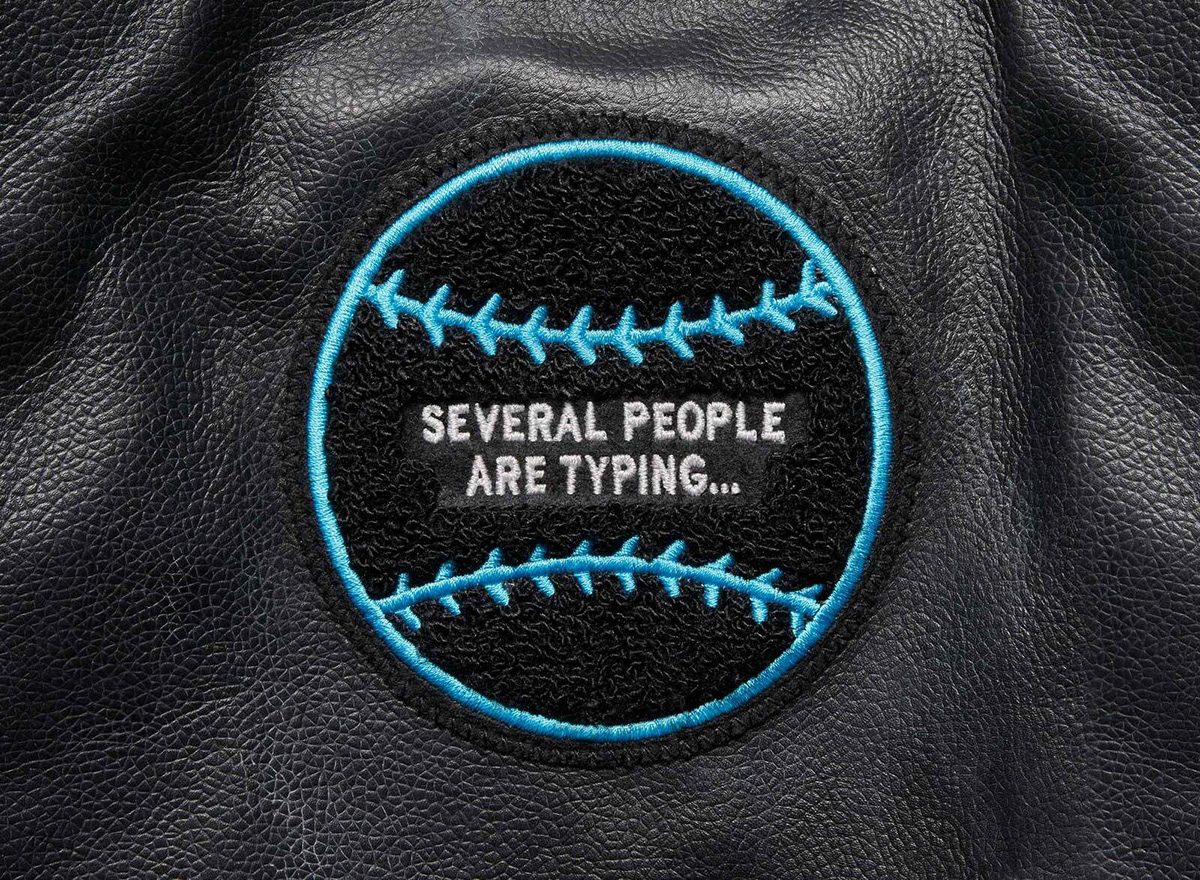 Detail of the "Several People Are Typing..." Patch for the GIPHY 10 year letterman jacket