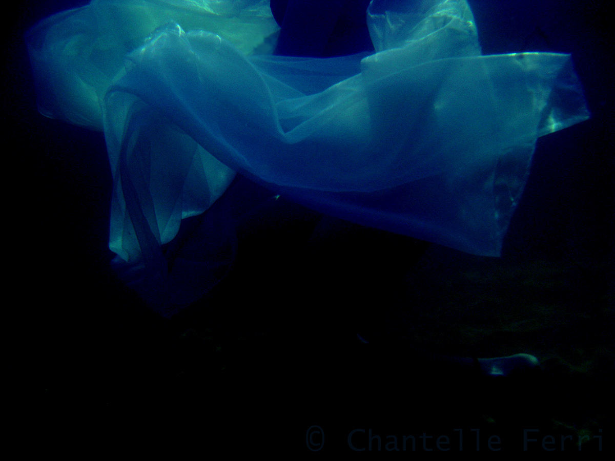 underwater girl reflection dark Moody submerged water fabric floating sinking aqua light swimming sea