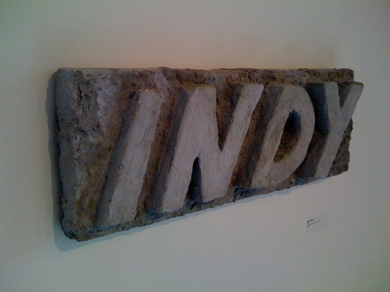 indy broken concrete sculpture fine art type words
