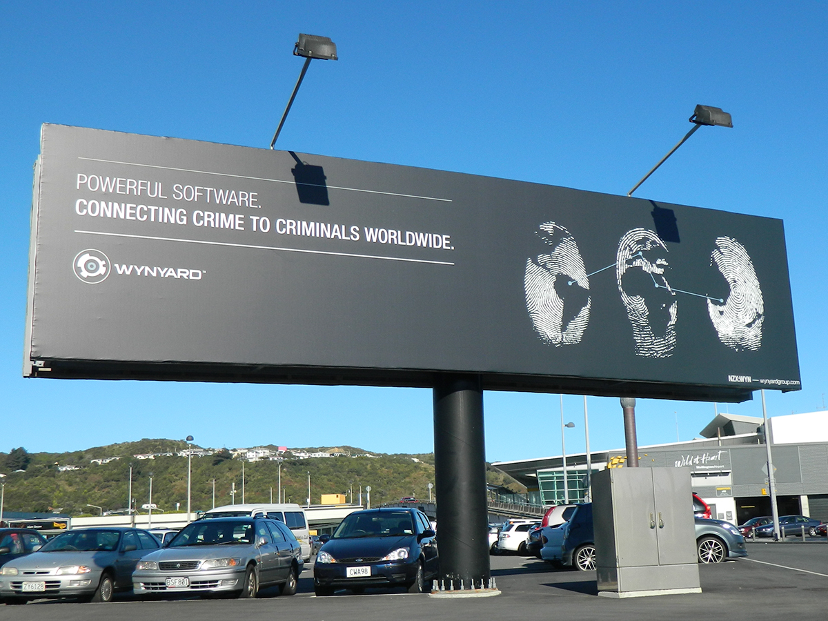 billboard wellington airport fingerprints Wynyard crime criminals advanced crime analytics software world map connect the dots simple clean subtle