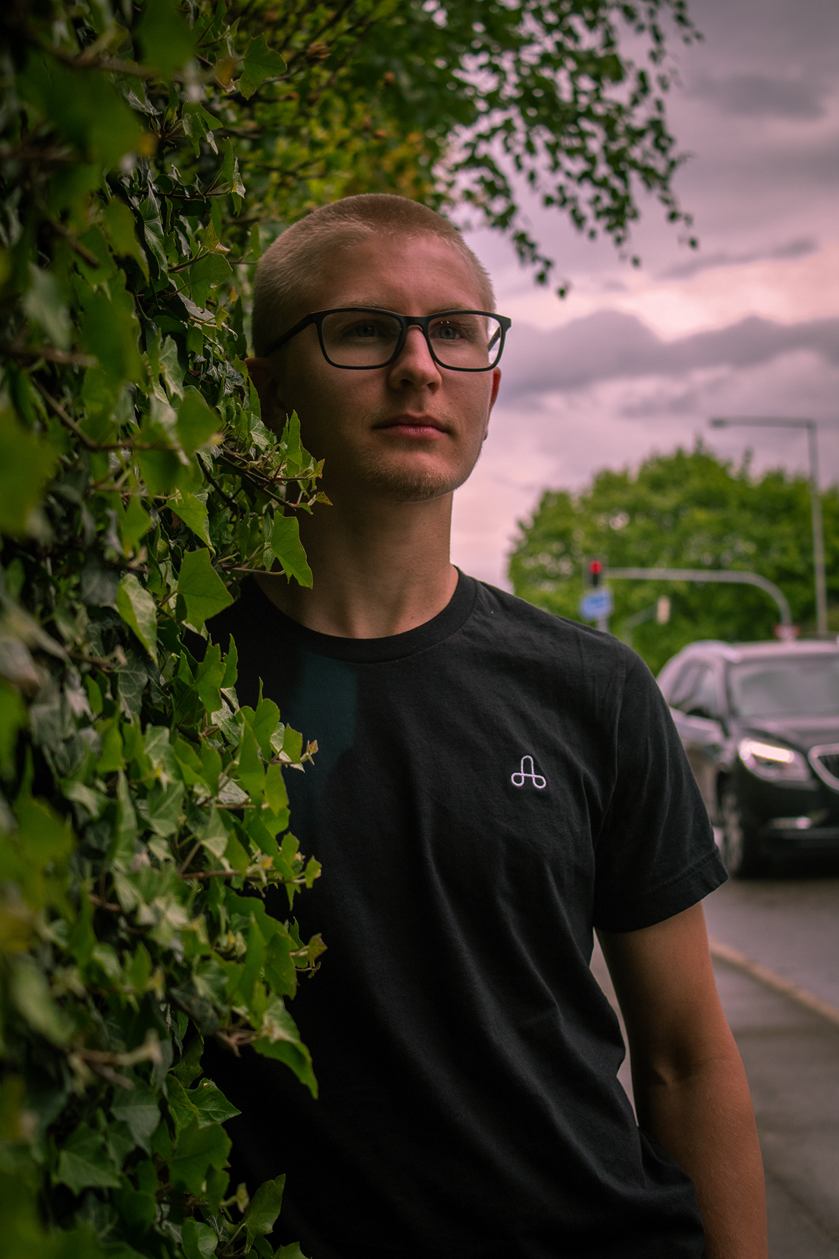 A half body shot of a model wearing the Uprising t-shrit