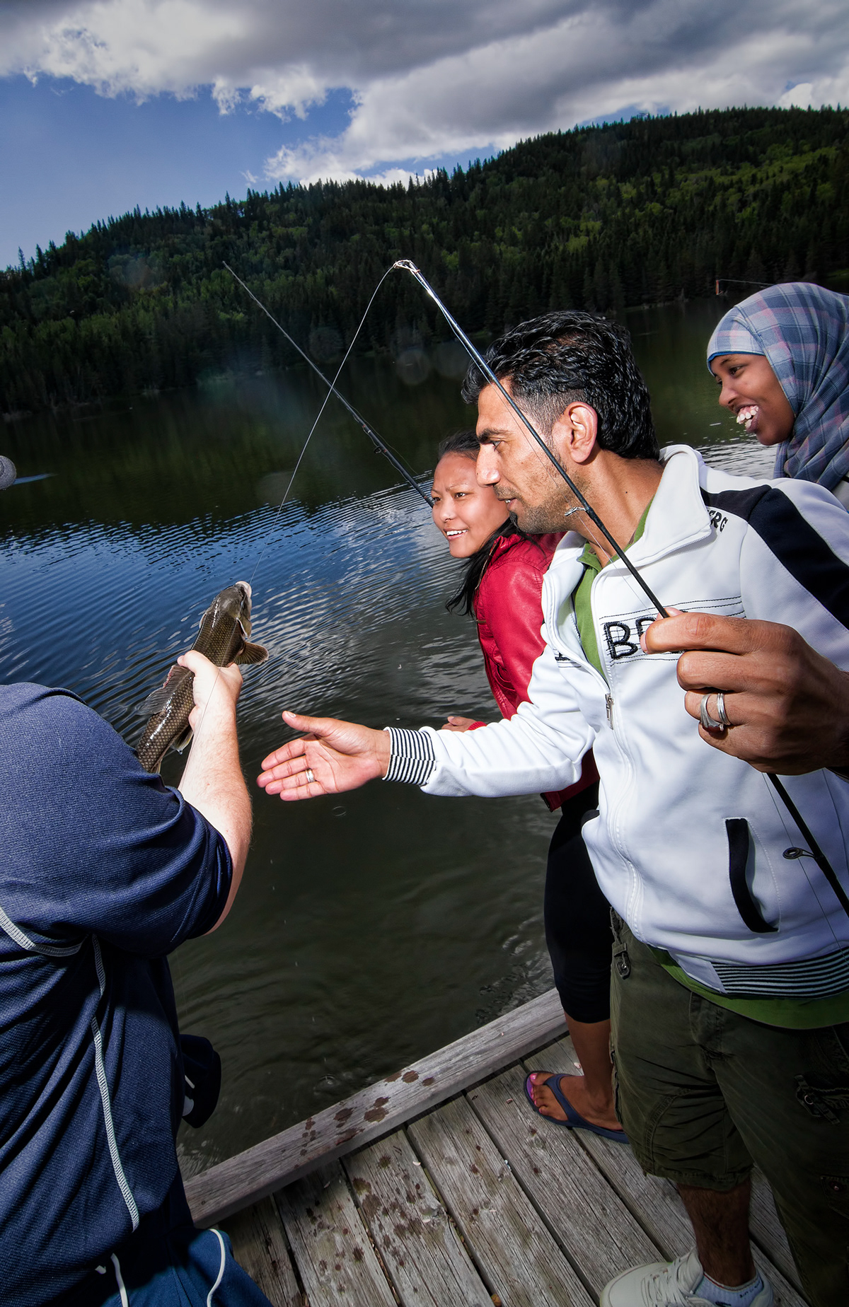 immigrants Canada alberta fishing outdoors fish recreation Canadians hills lake trees Park