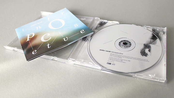 Amber Smith cd package inrtospective José Simon Simon Says package design 