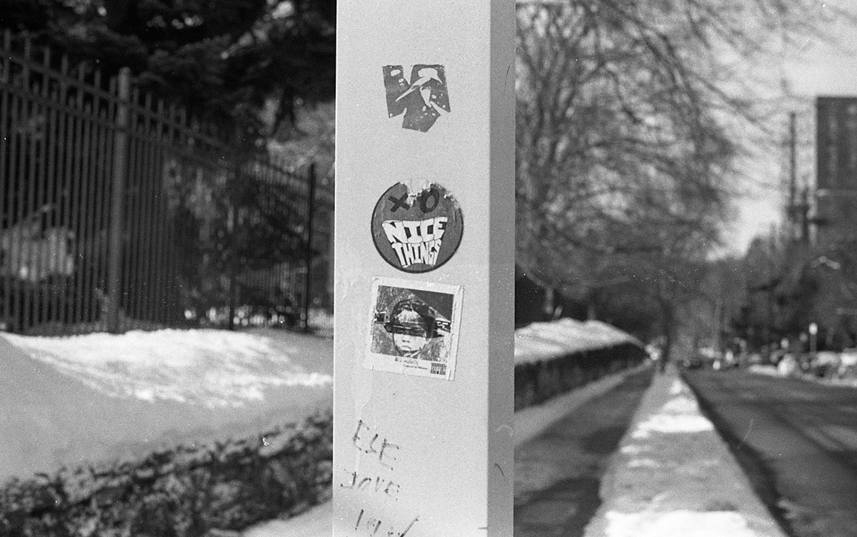 35mm photos sticker slap black and white black and white photograph barriers poles snow Perspective
