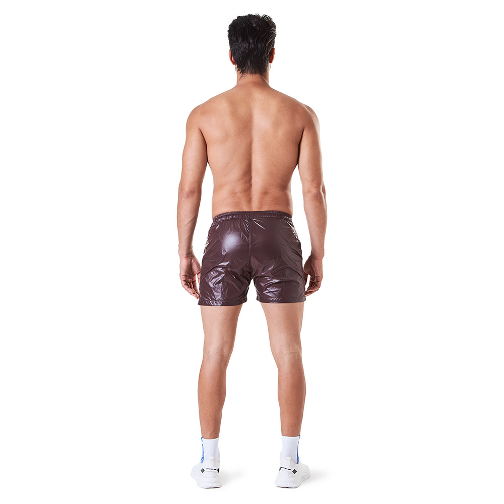 Image may contain: shorts, man and person