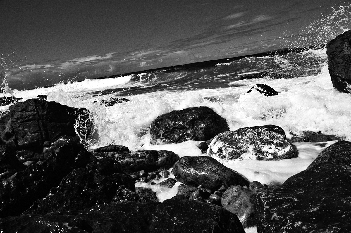 black and white rocks crashing waves Burren Ireland sheep Boats