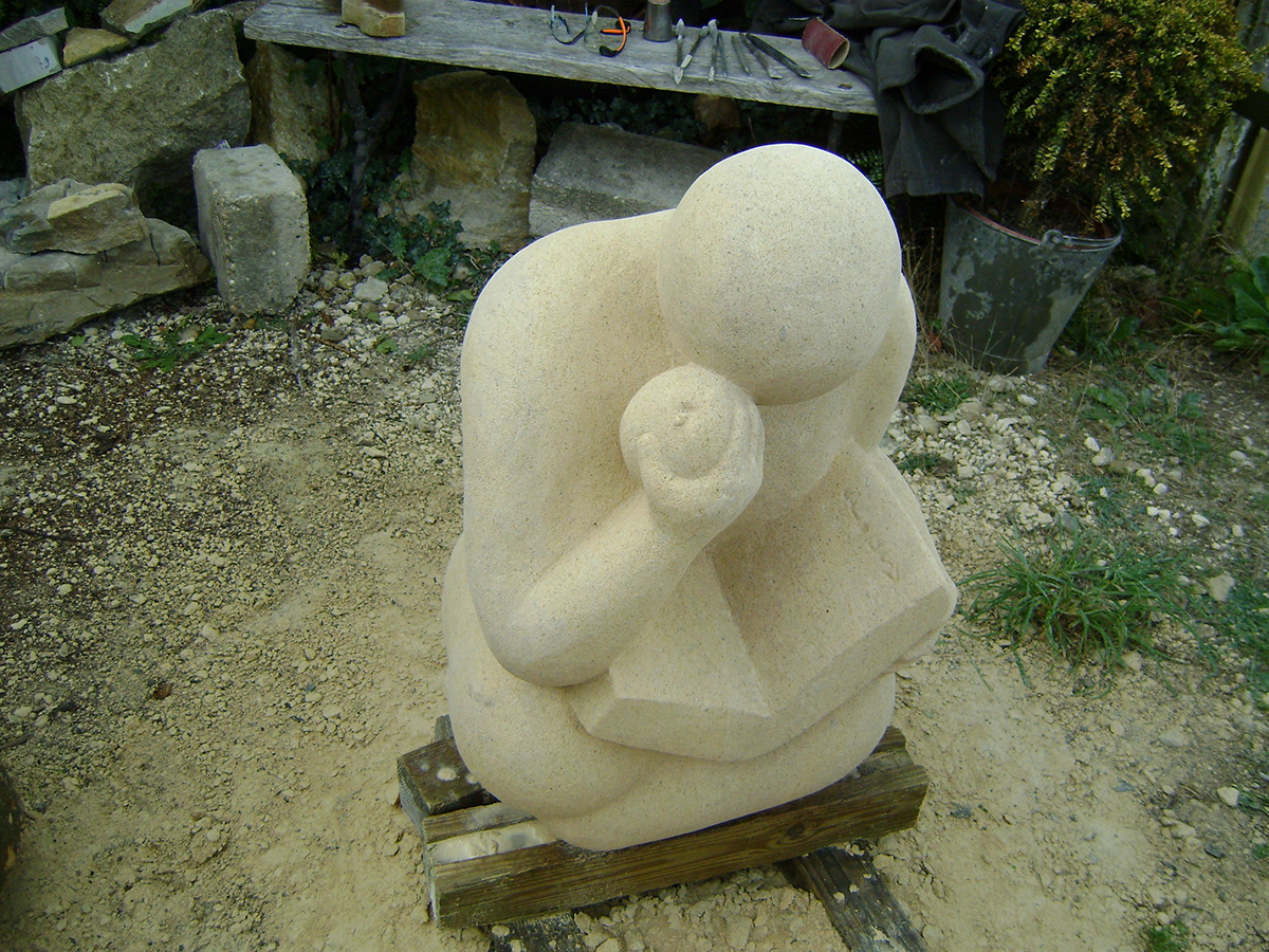 sculpture stone figure human Form book Reading relaxing carving Dorset UK female
