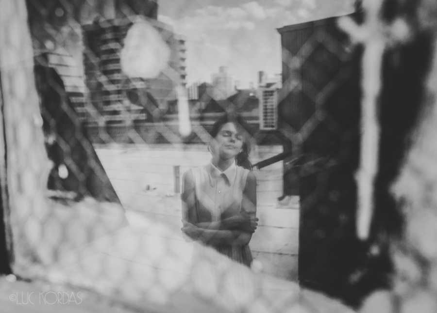 film noir nostalgia Melancholy b&w photo story slideshow nyc New York Luc Kordas rooftop white dress woman girl