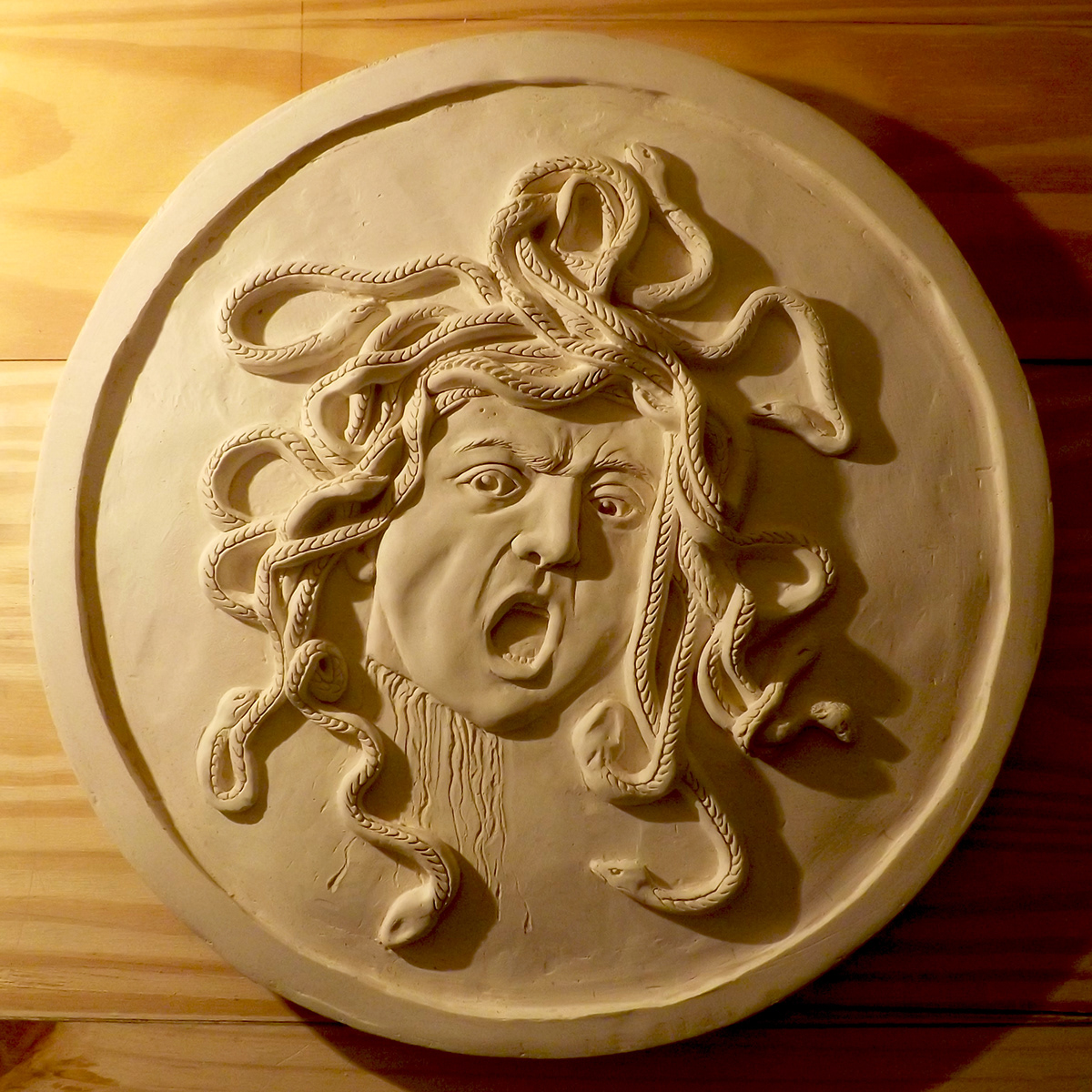 medusa clay plaster caravaggio relief sculpture snakes modelling portrait greek myth