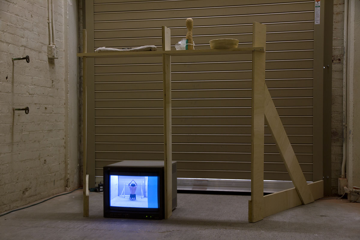 Performance sponge bath assault bathe Shelf wood whittle video video art loading dock installation site specific